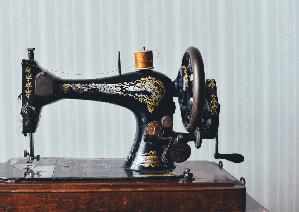 A beautiful antique sewing machine sitting on a table at home.